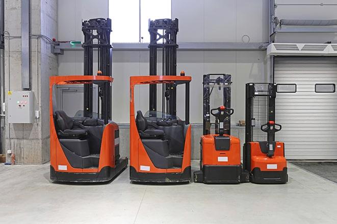 forklifts navigating through a busy industrial space